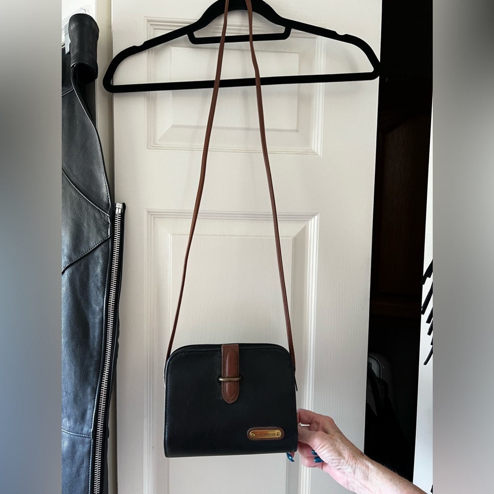Woman’s black with brown accents, crossbody purse